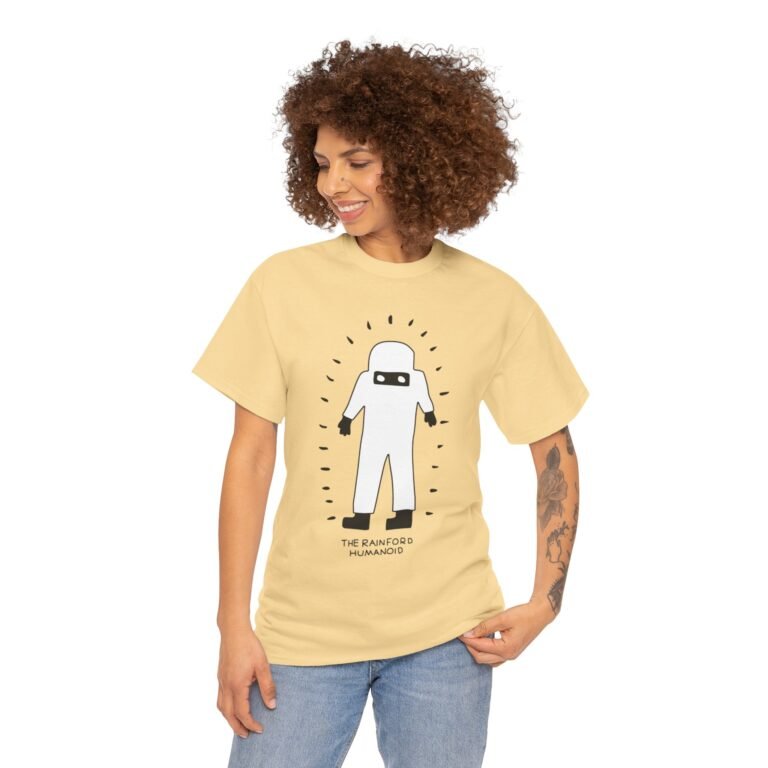 Unisex T-shirt featuring an artistic illustration of the Rainford Humanoid, inspired by a 1978 UFO encounter in Rainford, Lancashire. Paranormal-themed design for fans of UFO lore and British mystery sightings